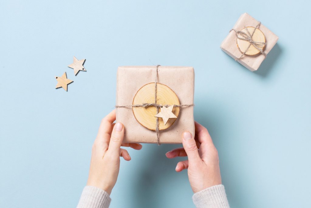 Woman's hands holding gift box